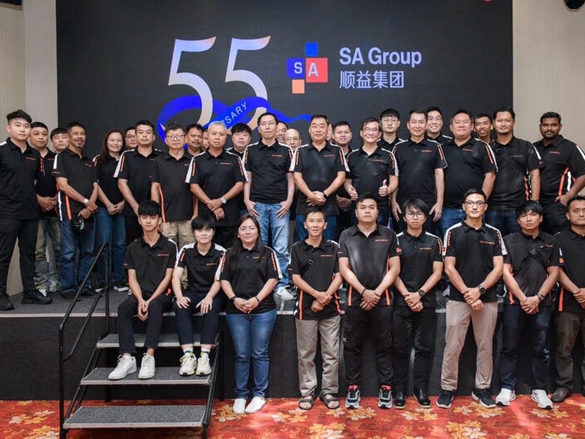 Soon Aik team gathered in front of the SA Group 55th anniversary backdrop